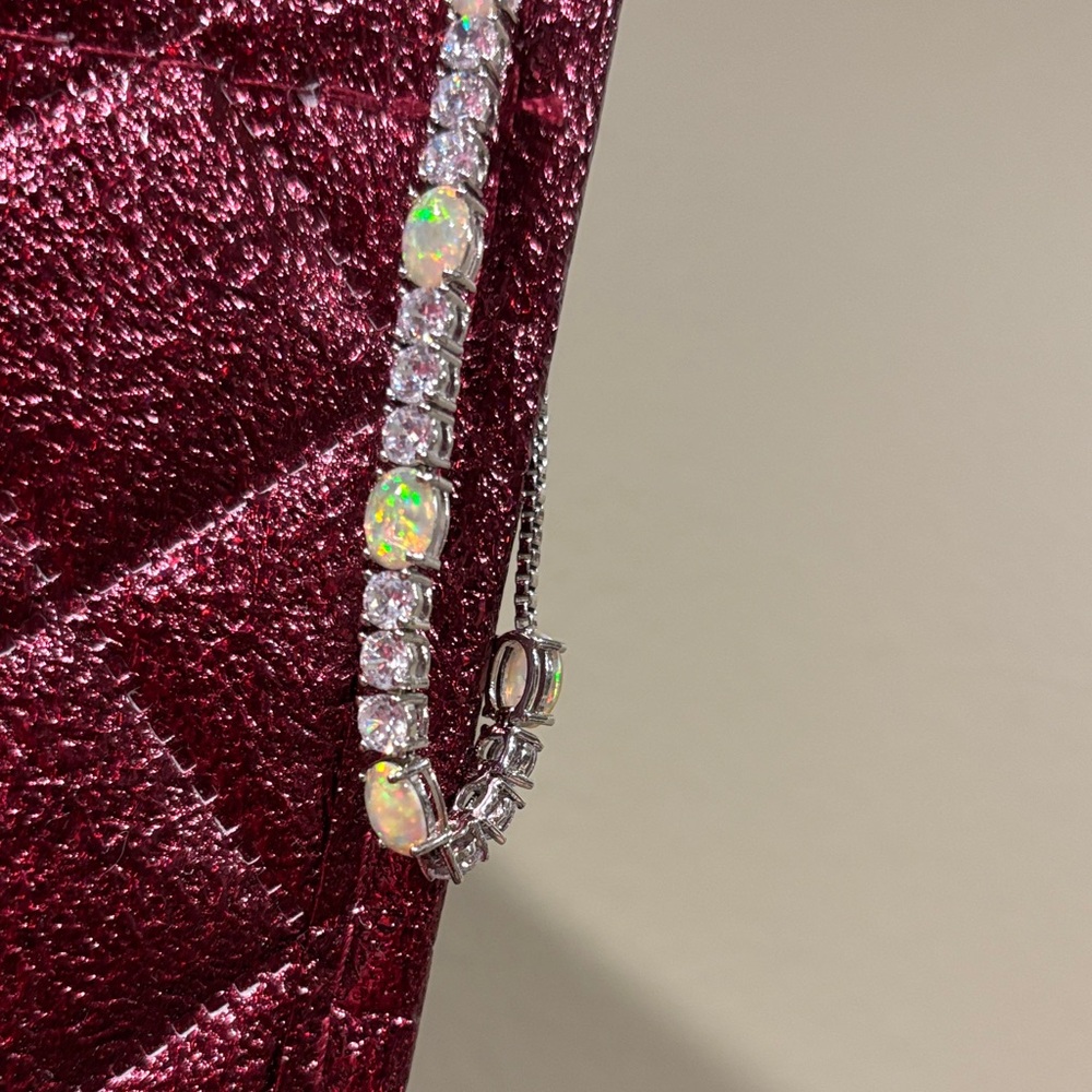 Red Quilted Bag with Silver and Opal Bracelet